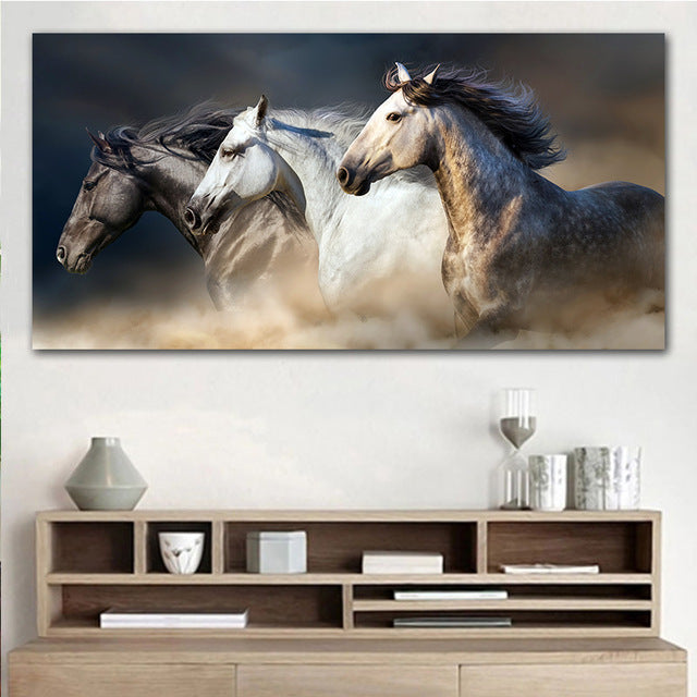Decorative painting of three horses galloping